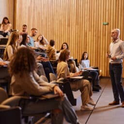 Professor talking on a class at lecture hall.