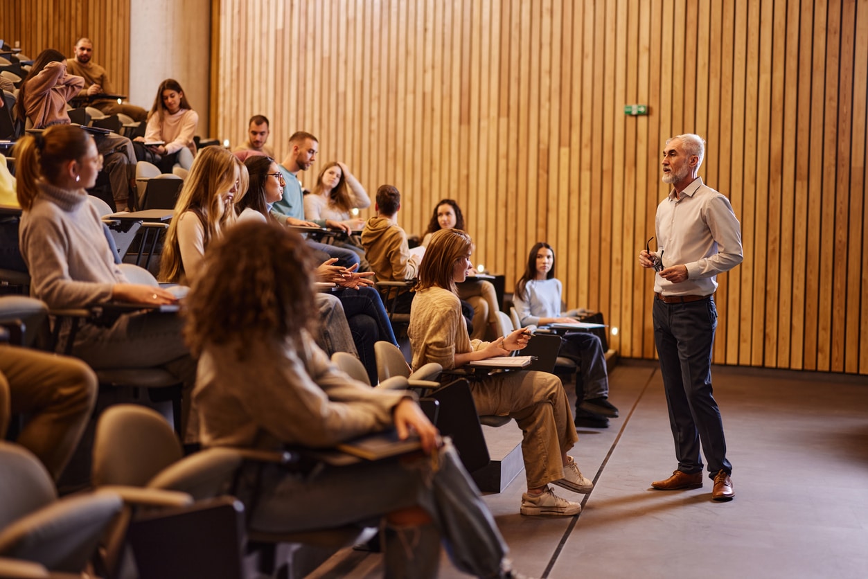 Professor talking on a class at lecture hall.