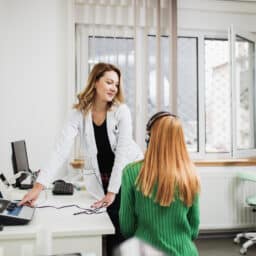 Audiologist conducting a hearing test.