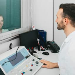 Woman taking a hearing exam.