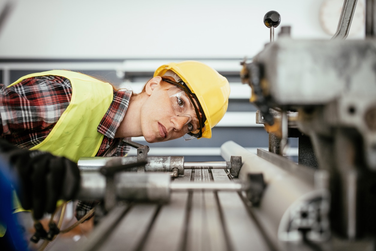 Woman checking the calibration of her machine.